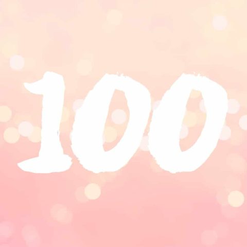 The number "100" is written in large white brushstroke-style font on a pink and yellow bokeh background.