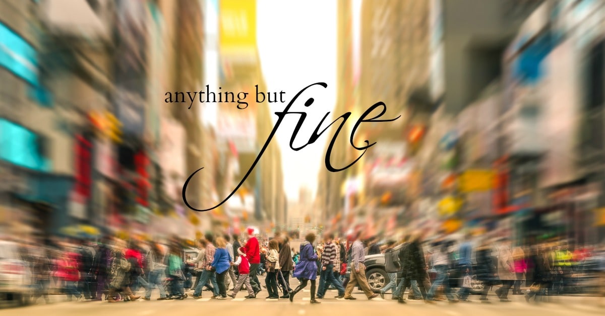 A blurred crowd crosses a busy city street with the words "anything but fine" in large, cursive text overlaid in the center.