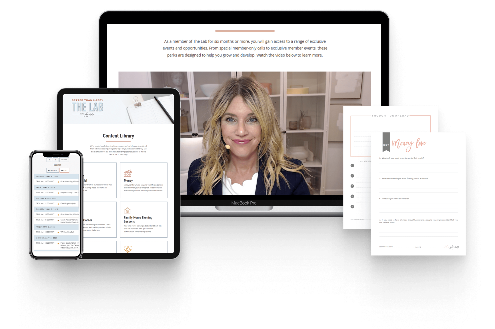 A laptop shows a woman speaking on video, with a tablet and smartphone displaying course materials, and printed worksheets placed nearby.