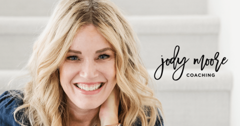 A woman with blonde hair smiles at the camera, sitting on light-colored stairs. Text on the image reads "Jody Moore Coaching," highlighting her expertise as a life coach.
