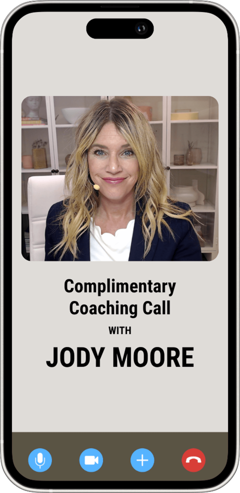A woman with blonde hair sits in front of shelves during a video call on a phone screen, advertising a complimentary coaching call with Jody Moore.